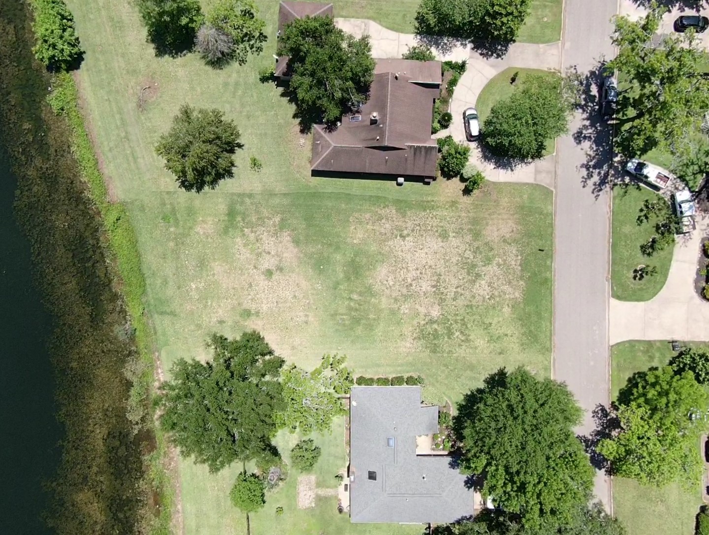 2209 Riverside Drive West Columbia, TX 77486 - Photo 6 of 9 an aerial view of residential house with outdoor space and trees all around