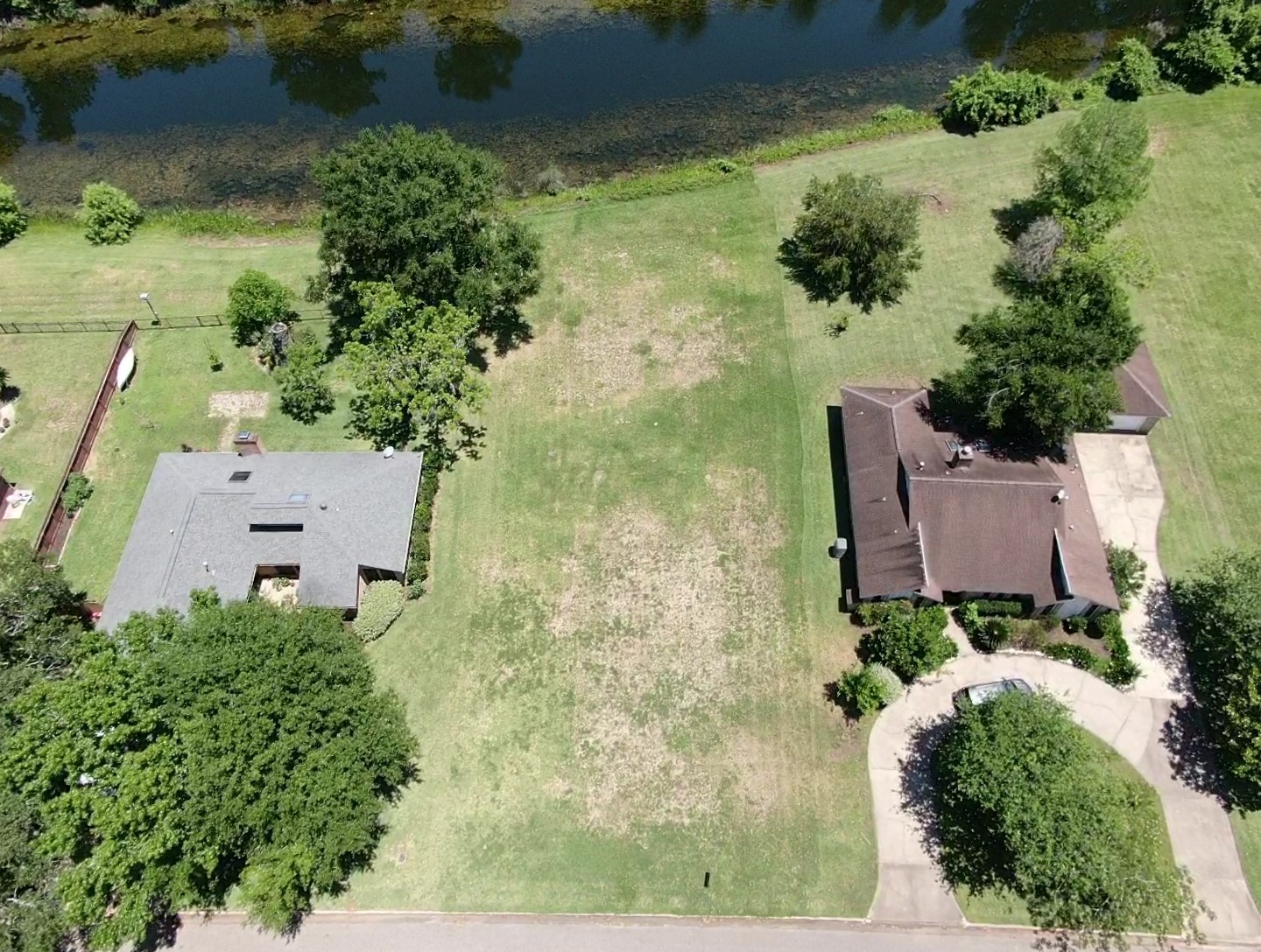 2209 Riverside Drive West Columbia, TX 77486 - Photo 7 of 9 an aerial view of a house with a yard
