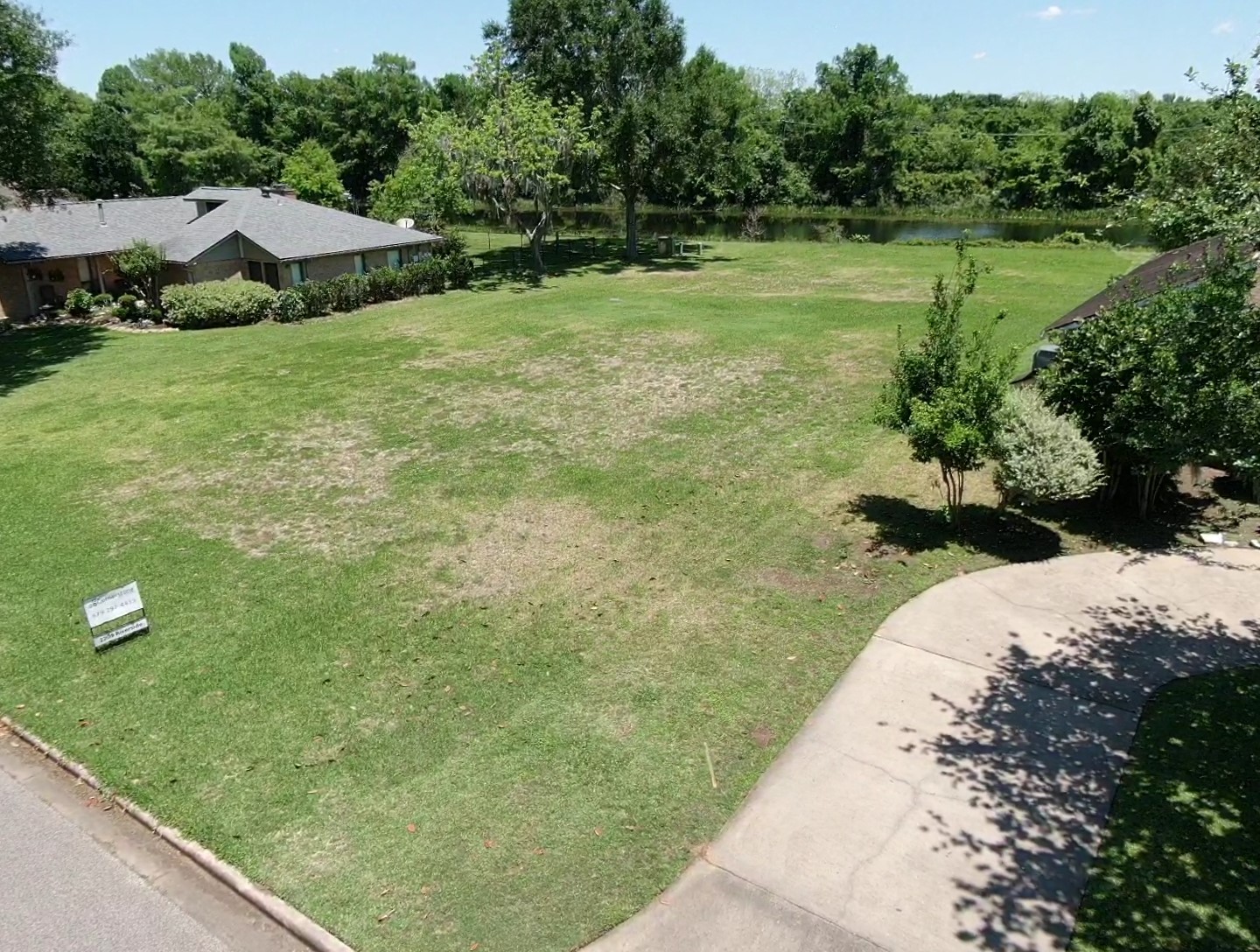 2209 Riverside Drive West Columbia, TX 77486 - Photo 8 of 9 a view of a garden with a building in the background