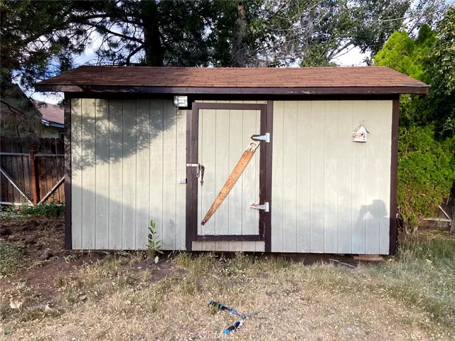a wooden door in front of a house