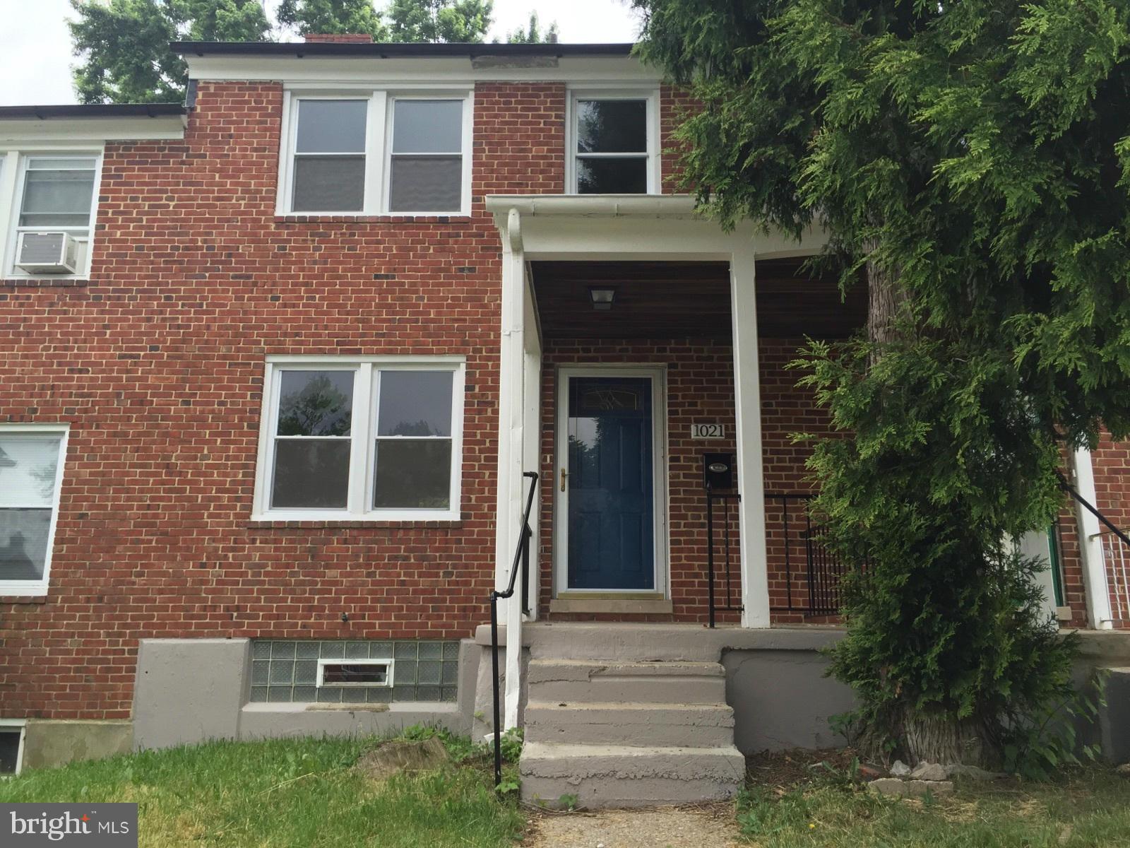 1021 Upnor Road Baltimore, MD 21212 - Photo 1 of 24 a front view of a house with plants