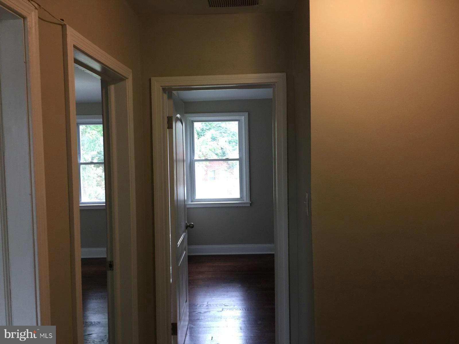 1021 Upnor Road Baltimore, MD 21212 - Photo 11 of 24 a view of a hallway with wooden floor