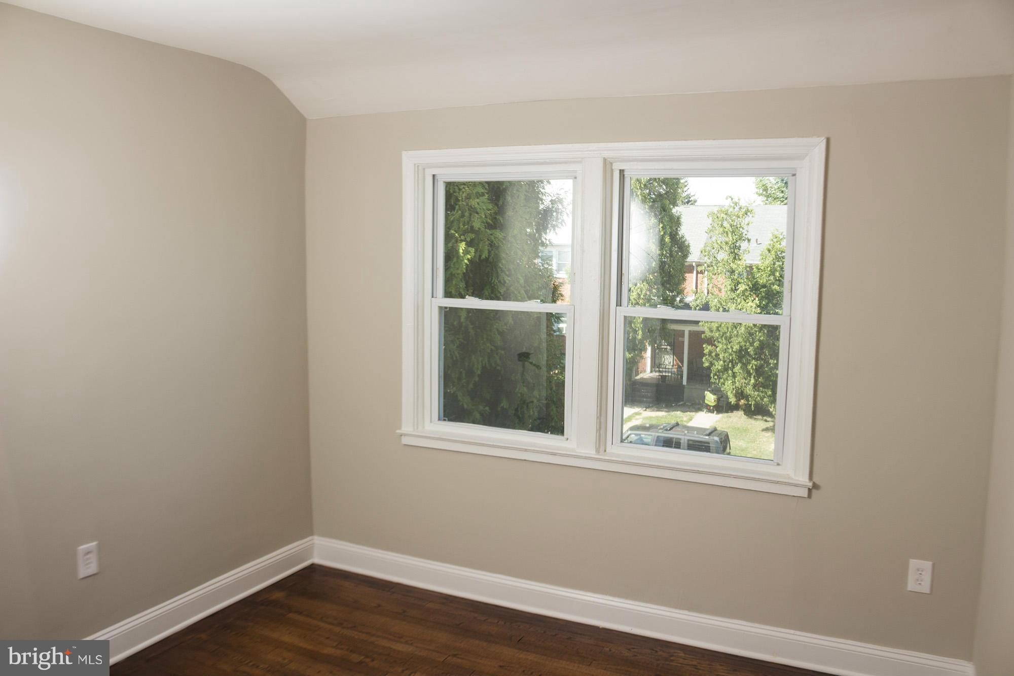 1021 Upnor Road Baltimore, MD 21212 - Photo 15 of 24 a view of a small space with wooden floor and a window