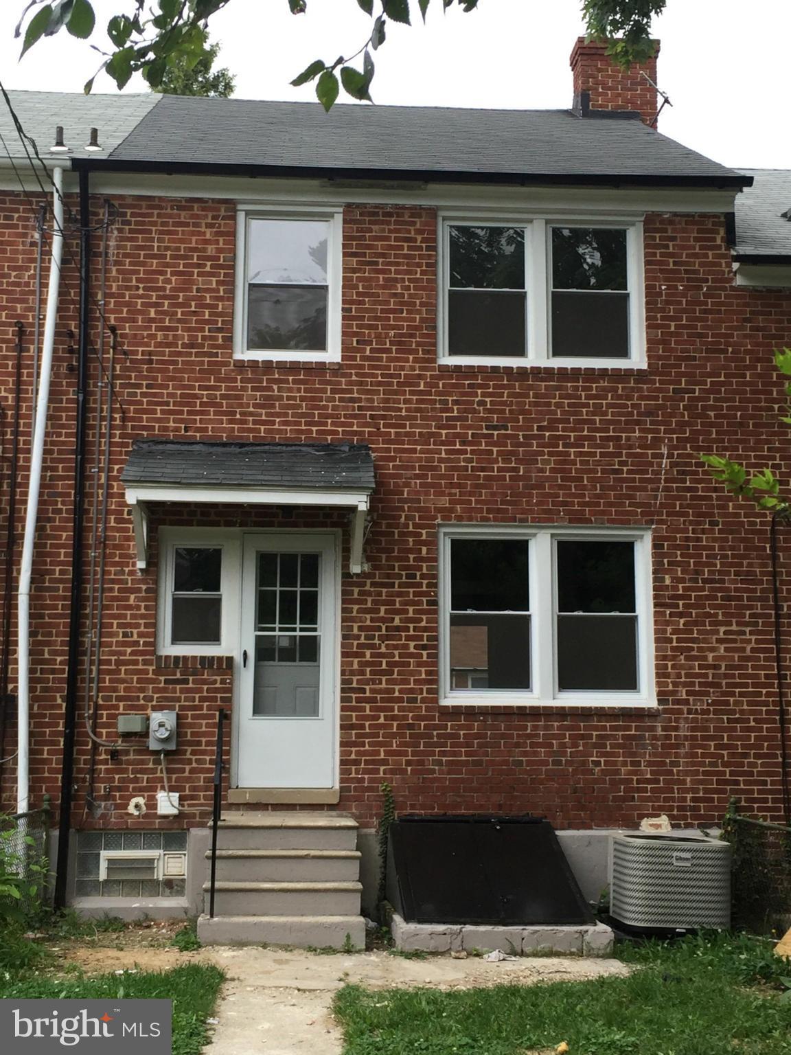 1021 Upnor Road Baltimore, MD 21212 - Photo 3 of 24 a front view of a house with yard