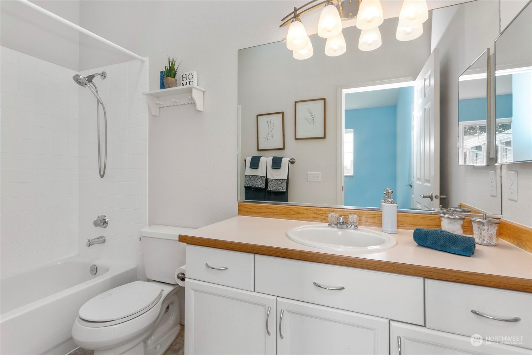 22619 4th Avenue West, Unit 104 Bothell, WA 98021 - Photo 13 of 19 a bathroom with a sink a toilet and a mirror