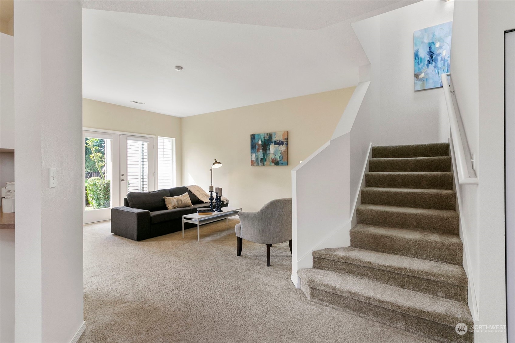 22619 4th Avenue West, Unit 104 Bothell, WA 98021 - Photo 3 of 19 a living room with furniture and stairs