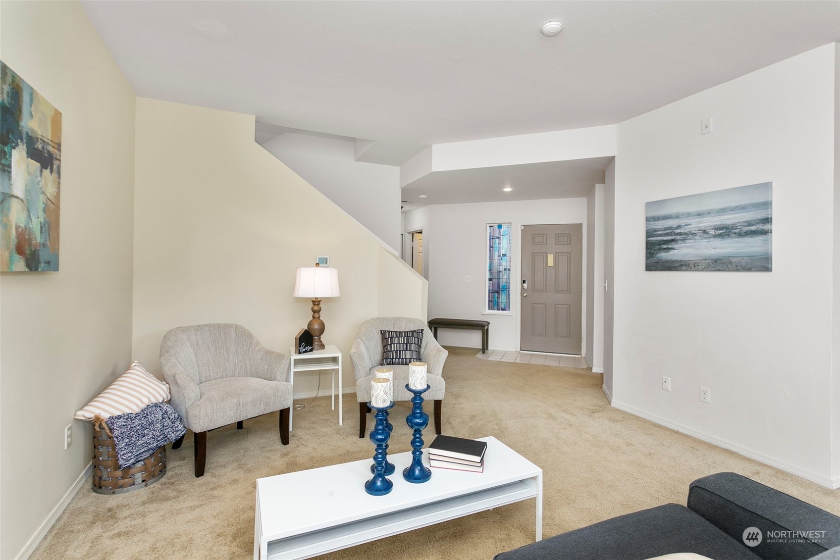 22619 4th Avenue West, Unit 104 Bothell, WA 98021 - Photo 8 of 19 a living room with furniture and a chandelier