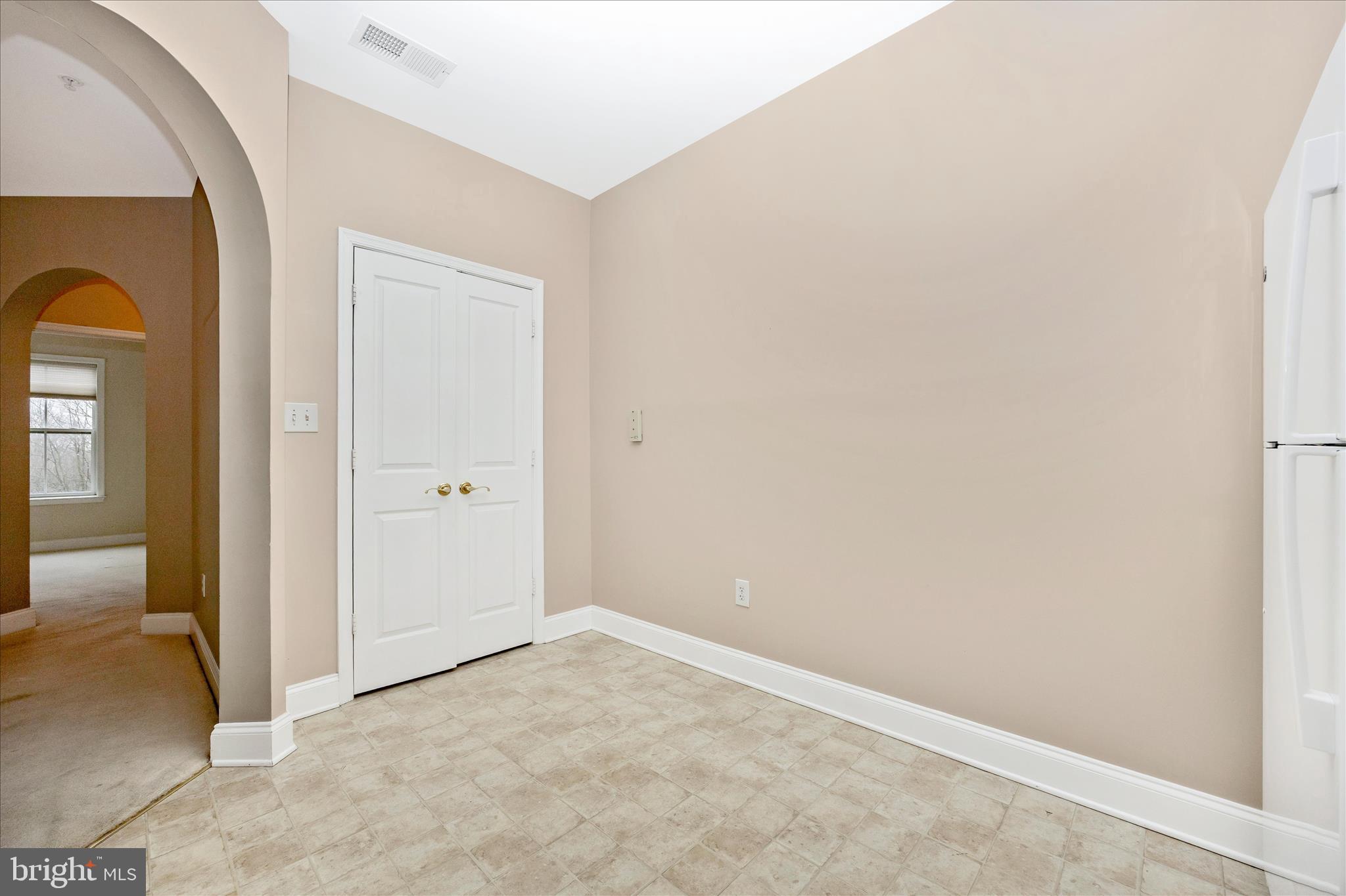 2250 Bear Den Road, Unit 207 Frederick, MD 21701 - Photo 13 of 43 an empty room with windows