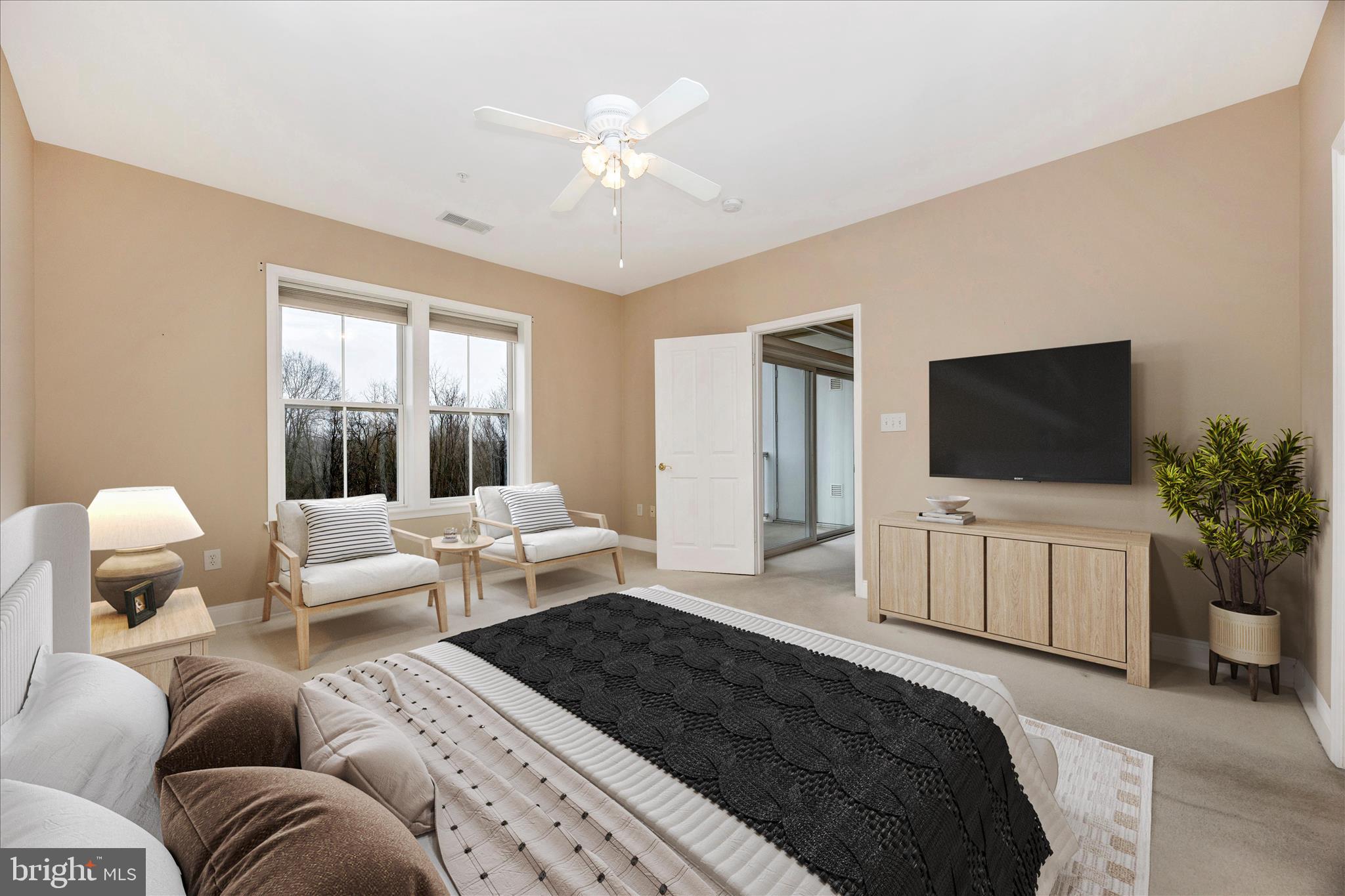 2250 Bear Den Road, Unit 207 Frederick, MD 21701 - Photo 14 of 43 a bedroom with a large bed and a flat screen tv