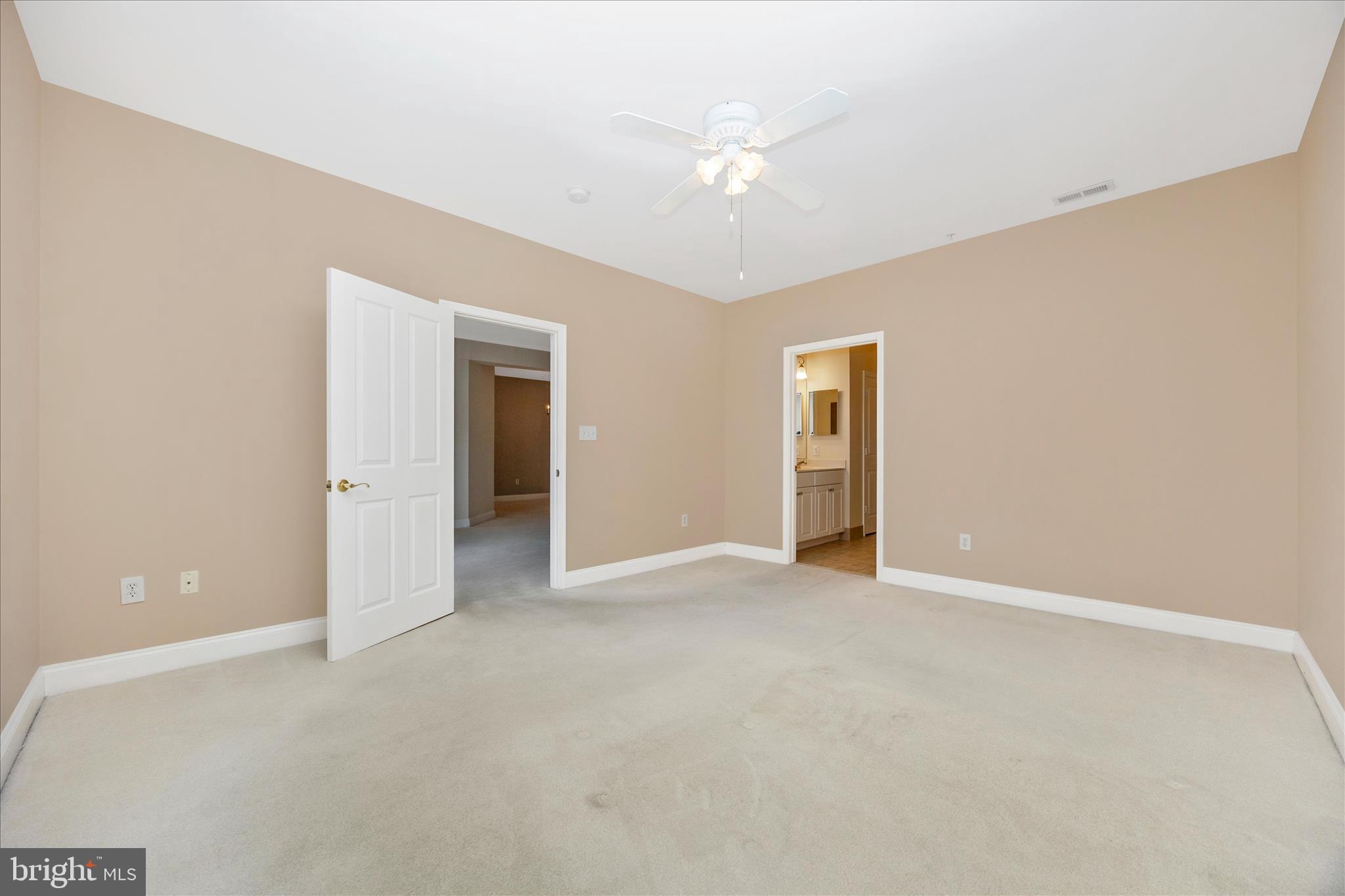 2250 Bear Den Road, Unit 207 Frederick, MD 21701 - Photo 17 of 43 a view of an empty room with chandelier fan