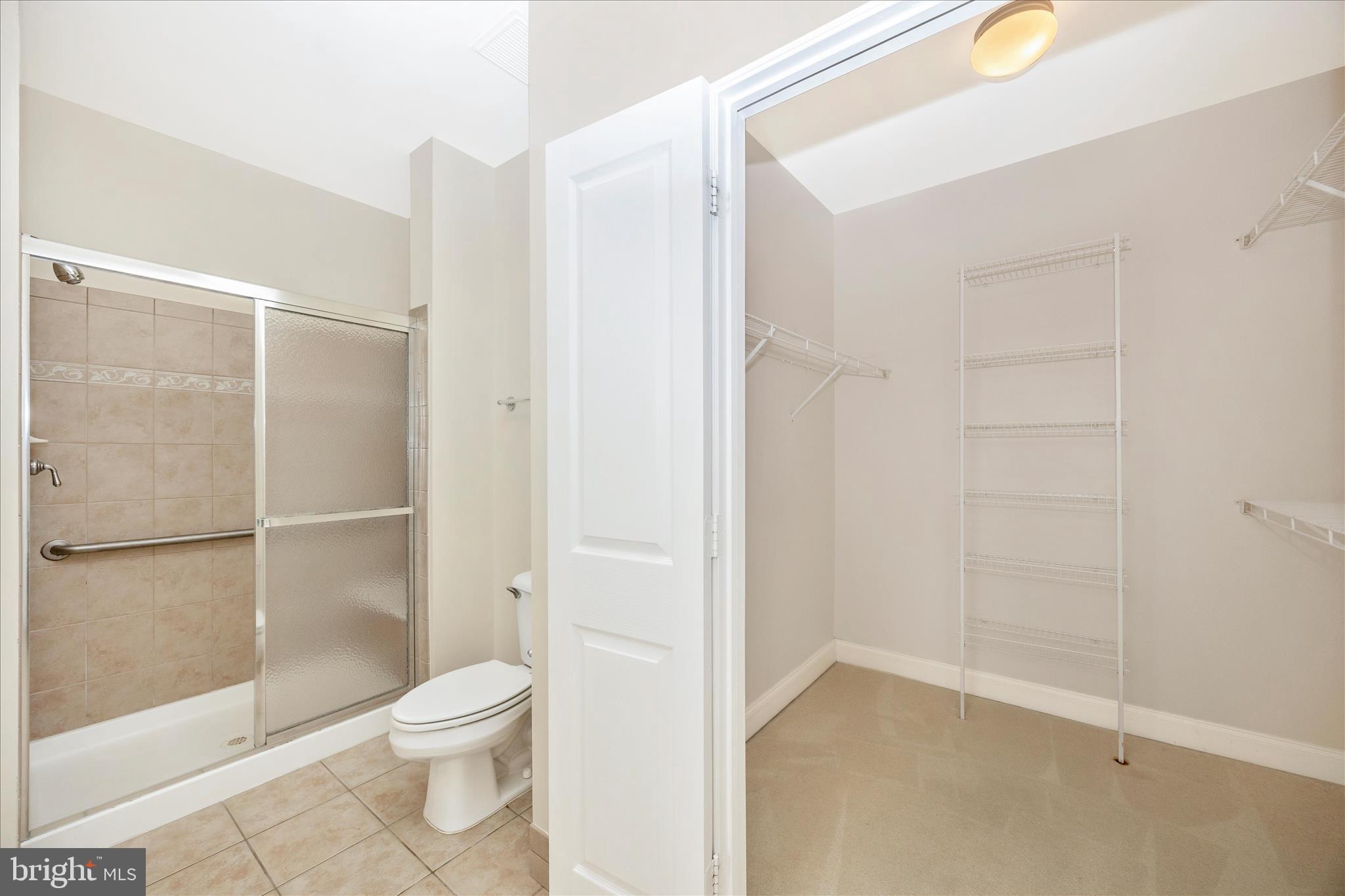 2250 Bear Den Road, Unit 207 Frederick, MD 21701 - Photo 19 of 43 a bathroom with a toilet and a shower