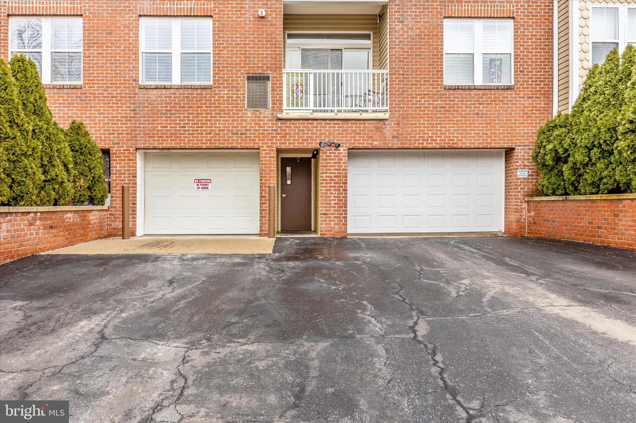 2250 Bear Den Road, Unit 207 Frederick, MD 21701 - Photo 29 of 43 a view of a house with a yard and garage
