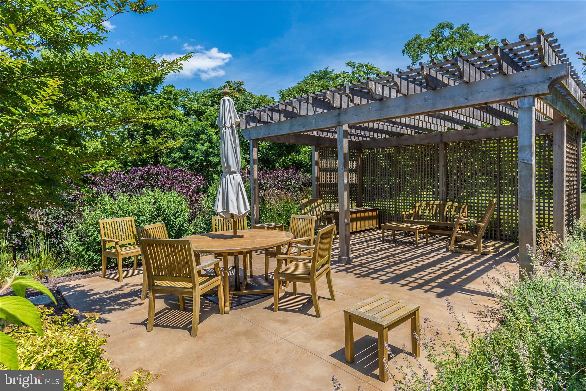 2250 Bear Den Road, Unit 207 Frederick, MD 21701 - Photo 32 of 43 a view of a patio with a table and chairs