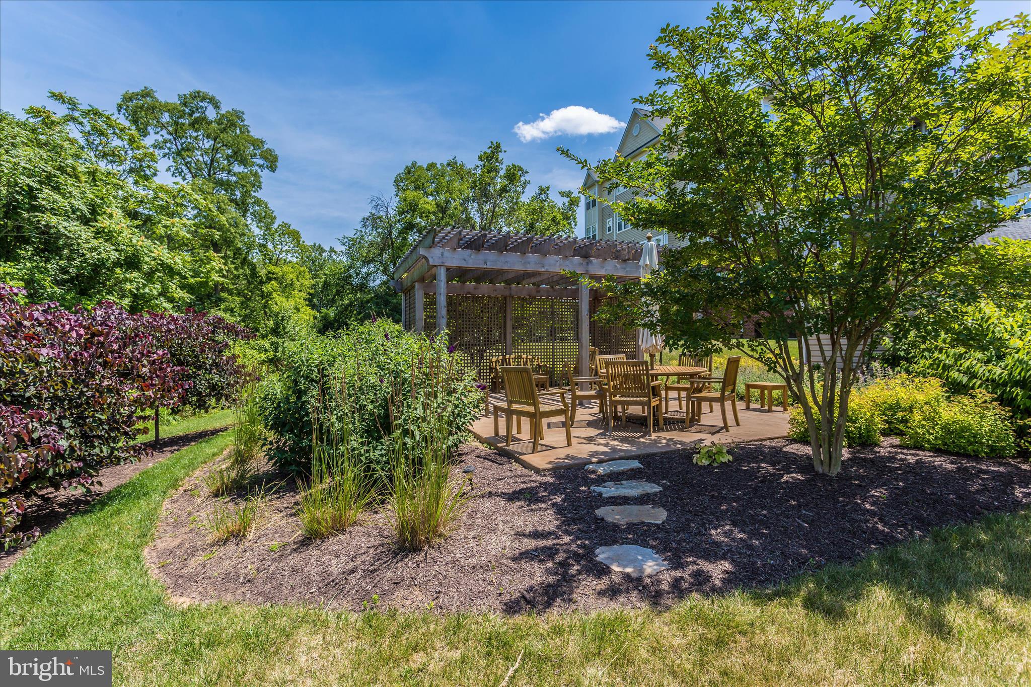 2250 Bear Den Road, Unit 207 Frederick, MD 21701 - Photo 33 of 43 a view of a house with a yard and sitting area