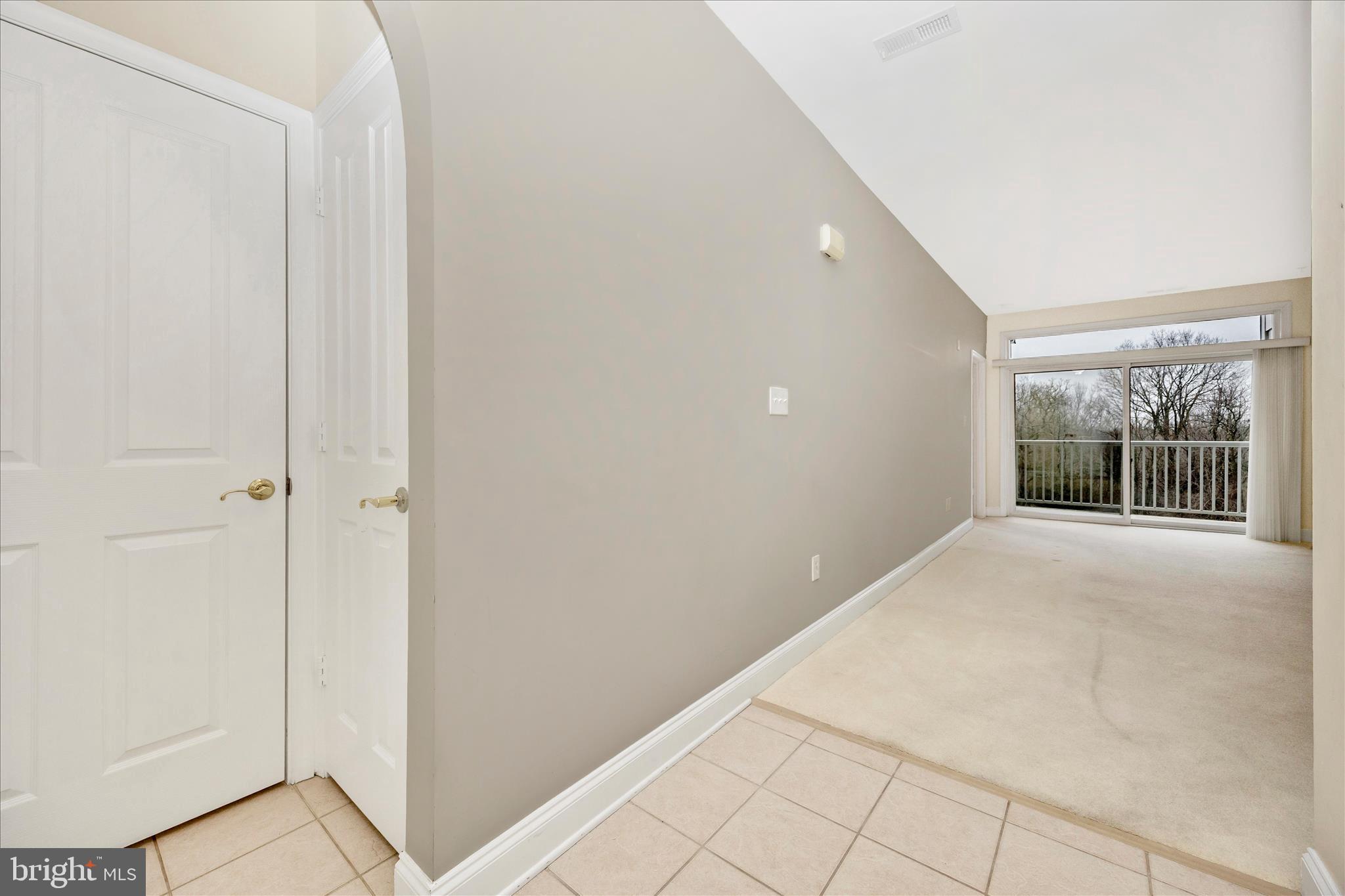 2250 Bear Den Road, Unit 207 Frederick, MD 21701 - Photo 4 of 43 a view of an empty room with window