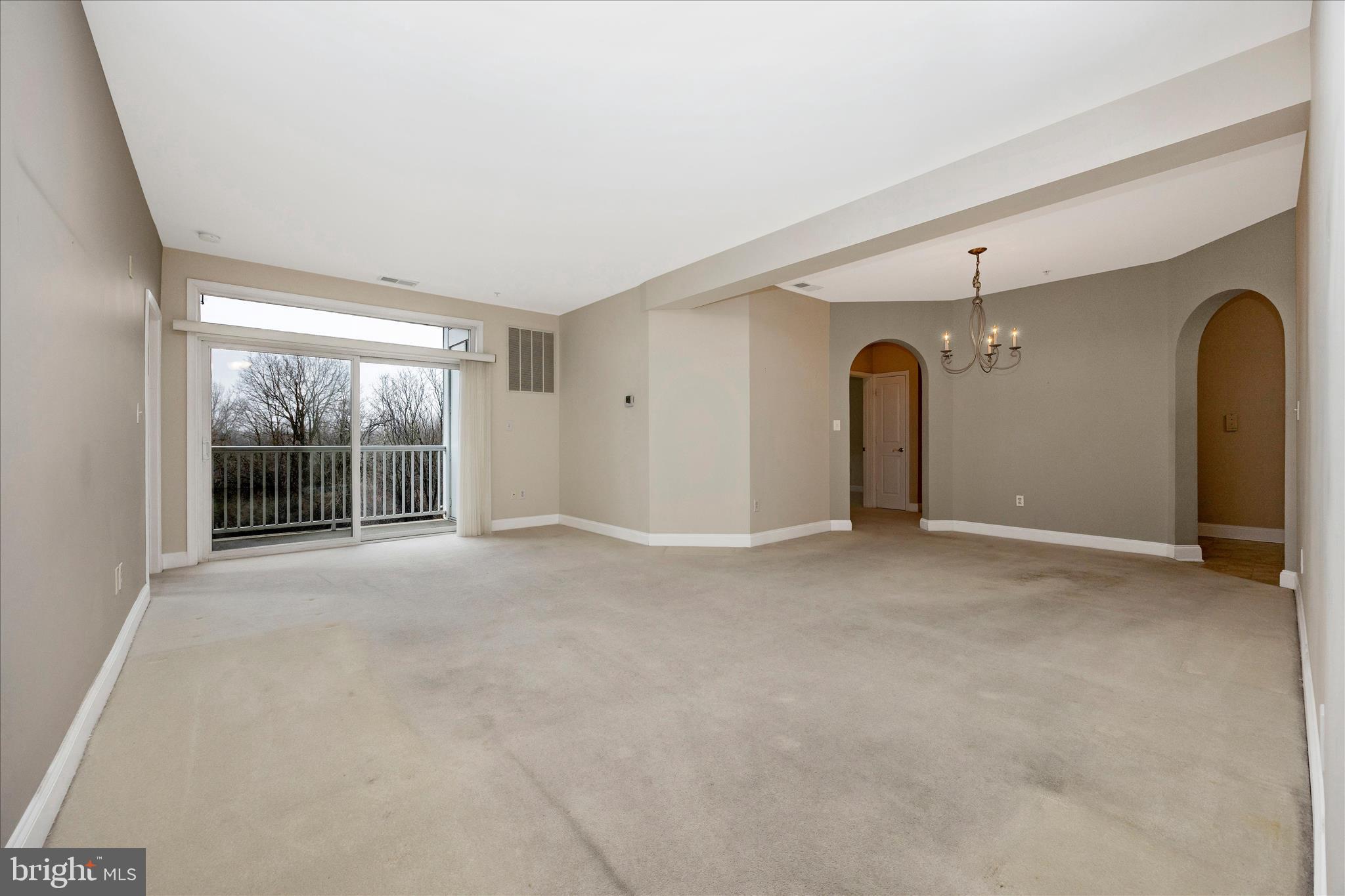 2250 Bear Den Road, Unit 207 Frederick, MD 21701 - Photo 6 of 43 an empty room with windows