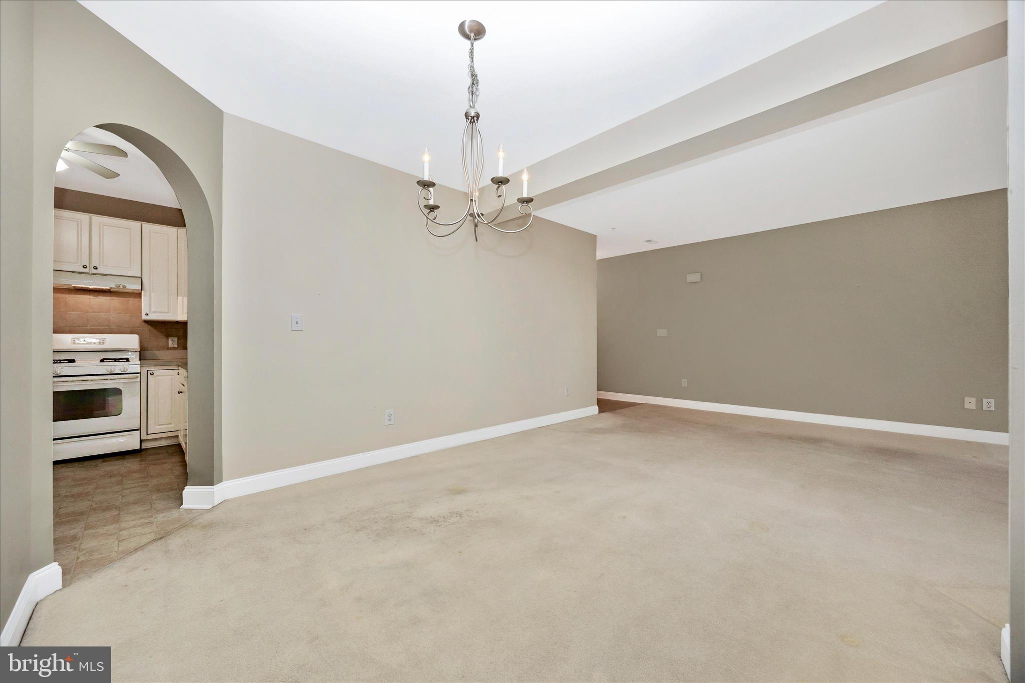 2250 Bear Den Road, Unit 207 Frederick, MD 21701 - Photo 9 of 43 an empty room with a ceiling fan and a window