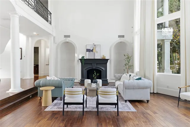 a living room with furniture and a fireplace