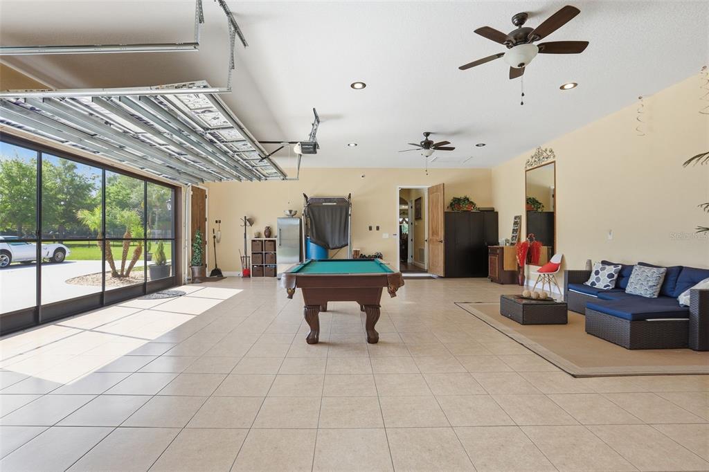 13429 Montevista Road Clermont, FL 34711 - Photo 54 of 89 a living room with furniture and a chandelier