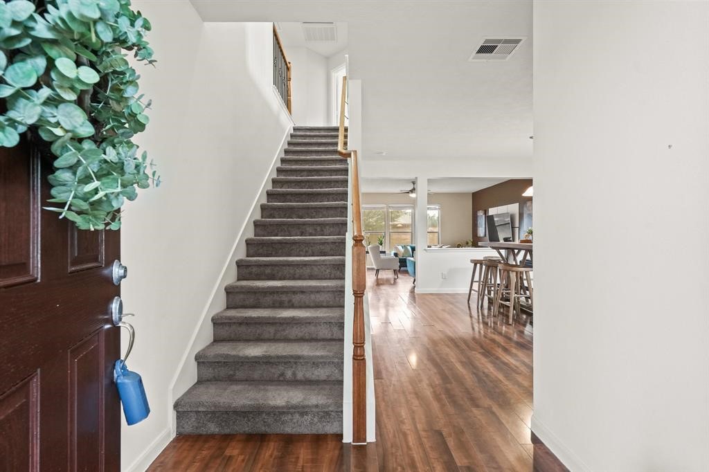 6719 Path Way Court Katy, TX 77449 - Photo 4 of 35 a view of entryway and hall with wooden floor
