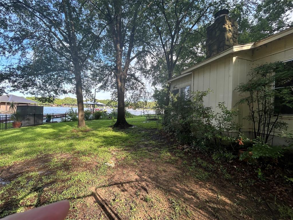 202 Thunderbird Mabank, TX 75156 - Photo 2 of 4 a view of backyard with green space