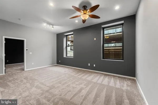 a view of an empty room with a window