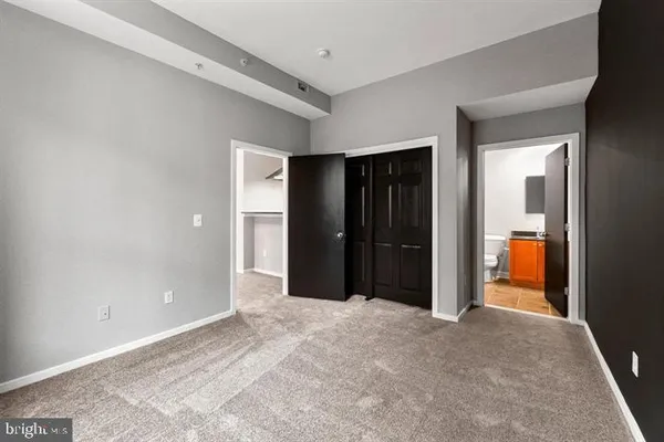 a view of a hallway with a room