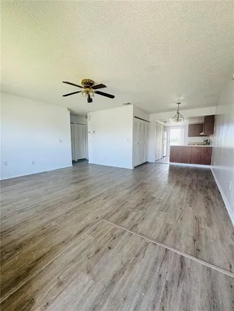 a view of a kitchen with a sink and cabinets