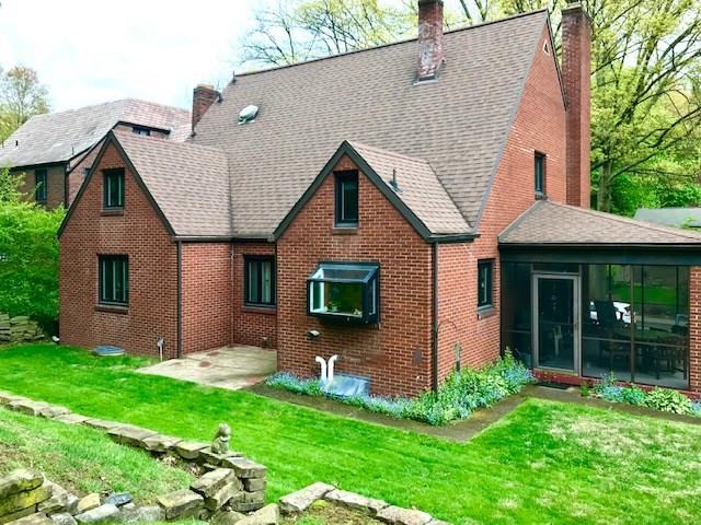 236 Cascade Road Pittsburgh, PA 15221 - Photo 3 of 25 Enjoy the patio that is right off the dining room and access to the level yard from the covered side porch as well.