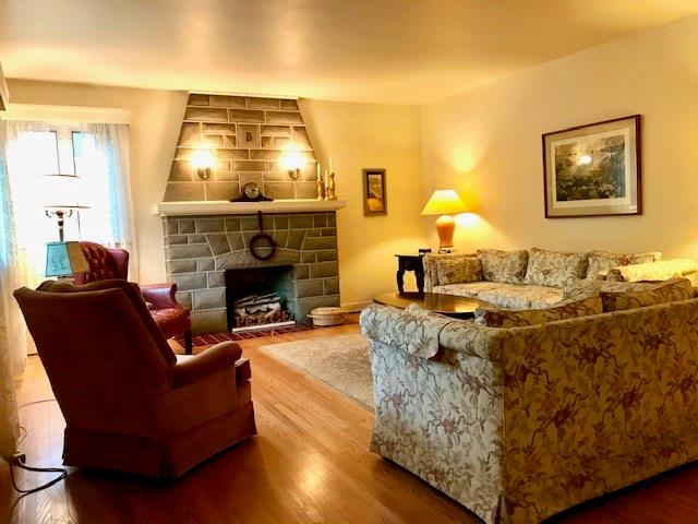 236 Cascade Road Pittsburgh, PA 15221 - Photo 4 of 25 Hardwood floors throughout most of the main level. Fireplace is decorative with pretty amazing built in sconces that add to the charm. Large windows allow the natural light to really brighten up the space.