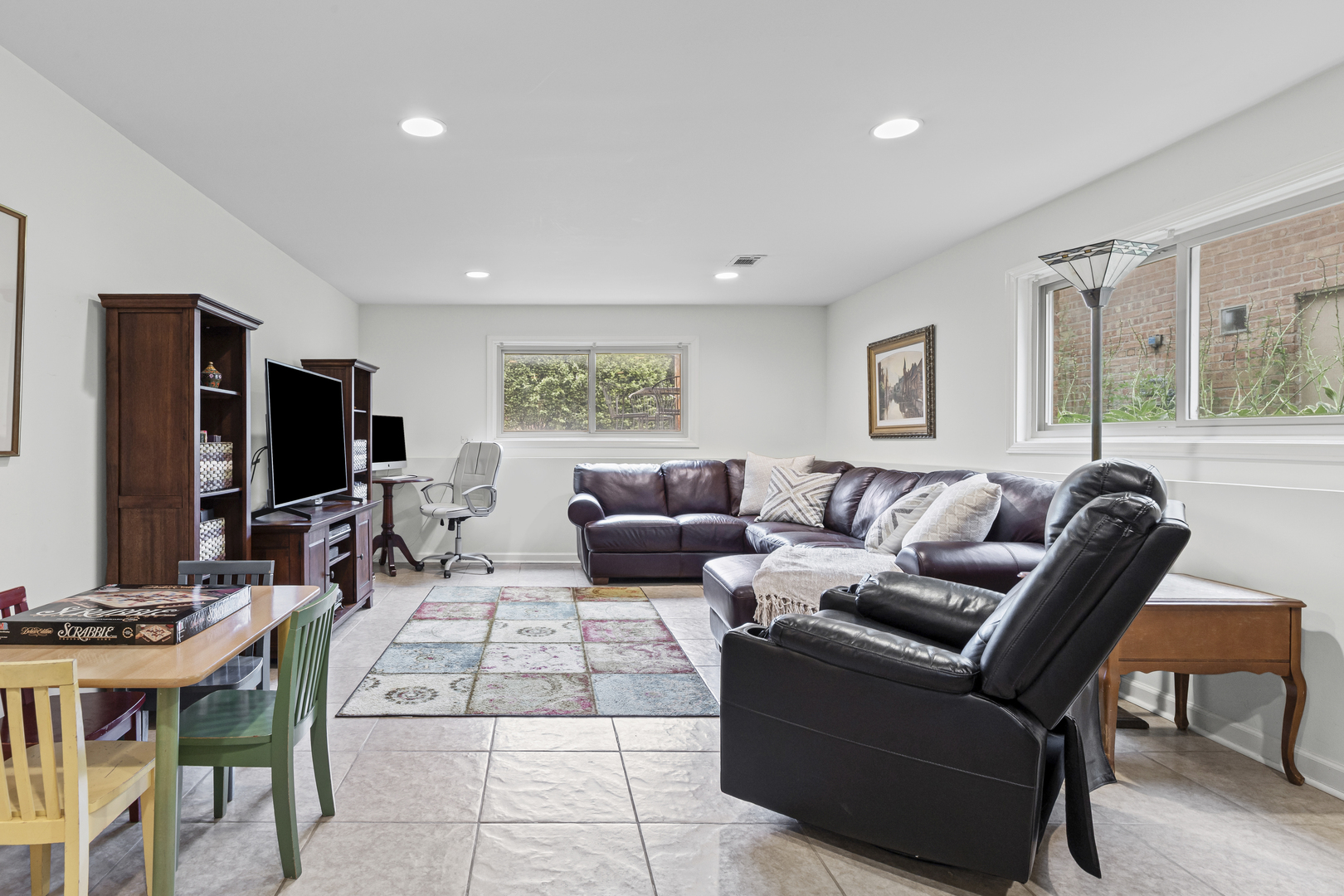 619 Leamington Avenue Wilmette, IL 60091 - Photo 14 of 19 a living room with furniture flat screen tv and a large window