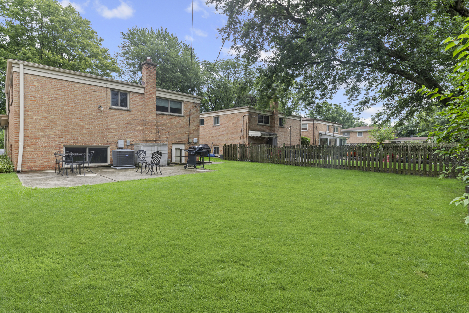 619 Leamington Avenue Wilmette, IL 60091 - Photo 18 of 19 a view of a house with a yard and sitting area