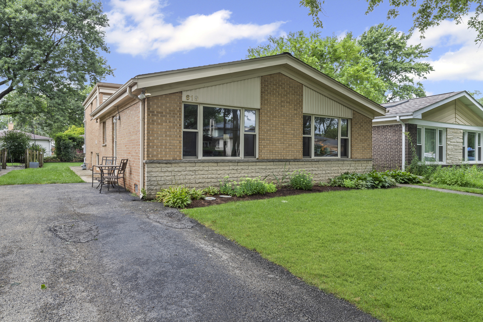 619 Leamington Avenue Wilmette, IL 60091 - Photo 19 of 19 a view of a house with yard and plants