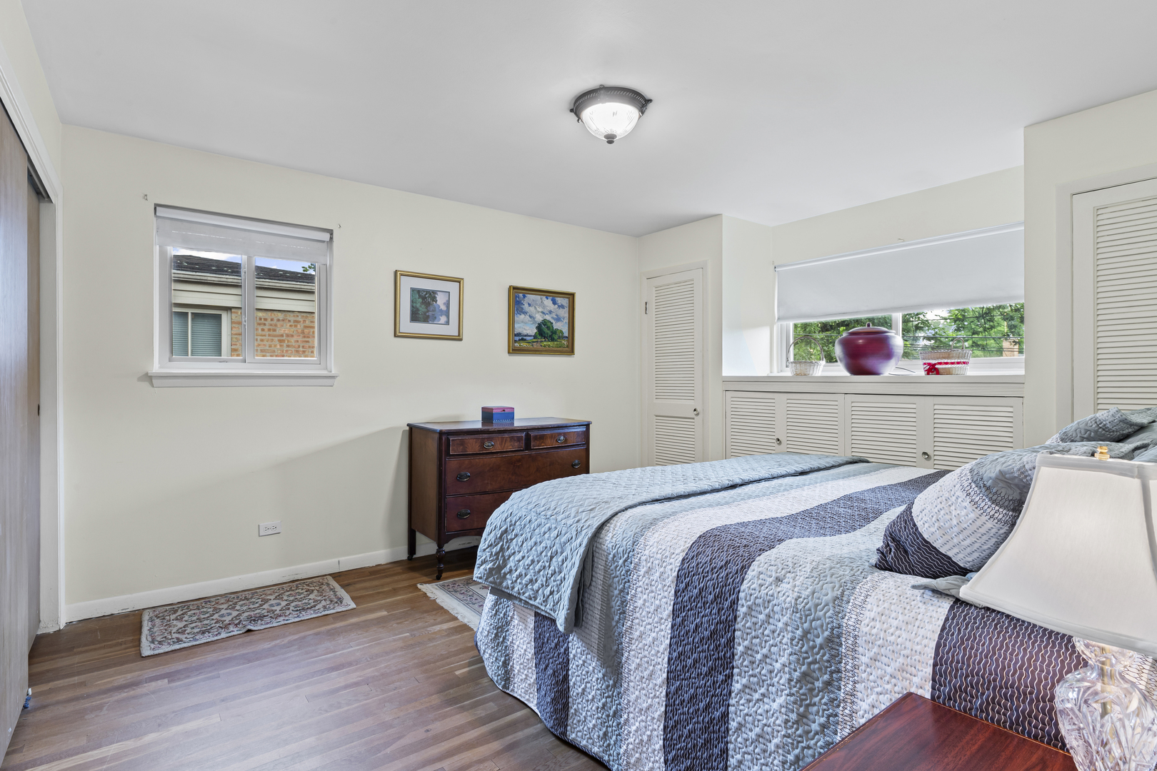619 Leamington Avenue Wilmette, IL 60091 - Photo 10 of 19 a bedroom with a bed and wooden floor