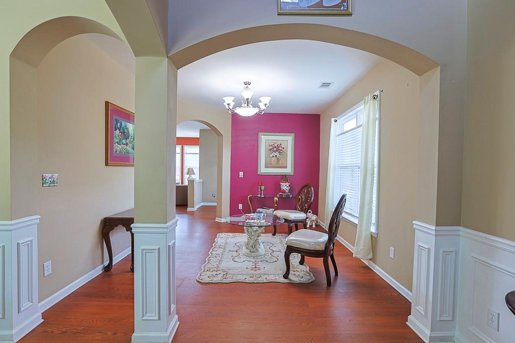 300 Hampton Place Canton, GA 30115 - Photo 5 of 82 a living room with furniture and a chandelier