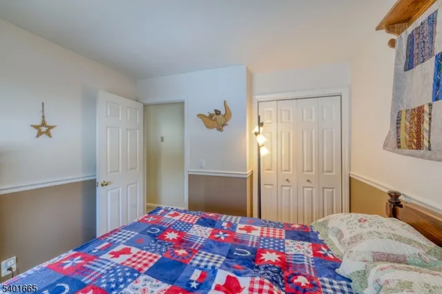 a view of a workspace with furniture and wooden floor