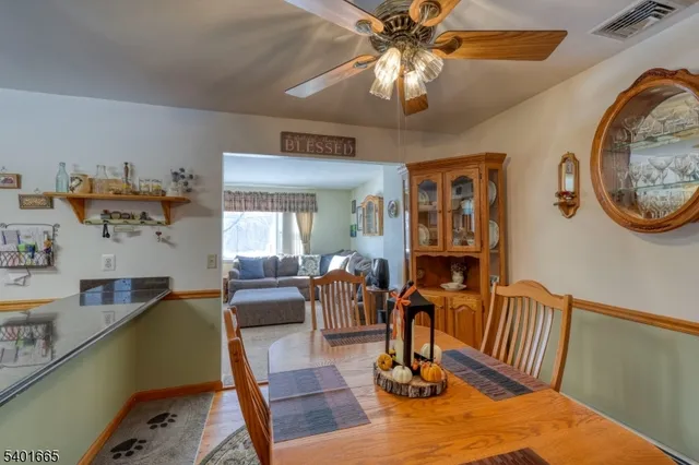 a kitchen with stainless steel appliances granite countertop a refrigerator sink and stove