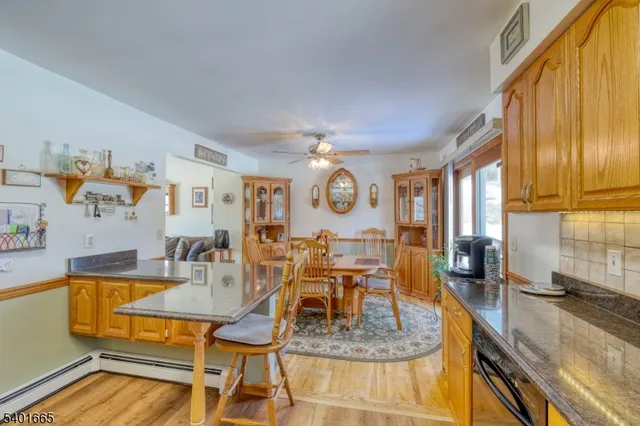a large kitchen with a large window and stainless steel appliances