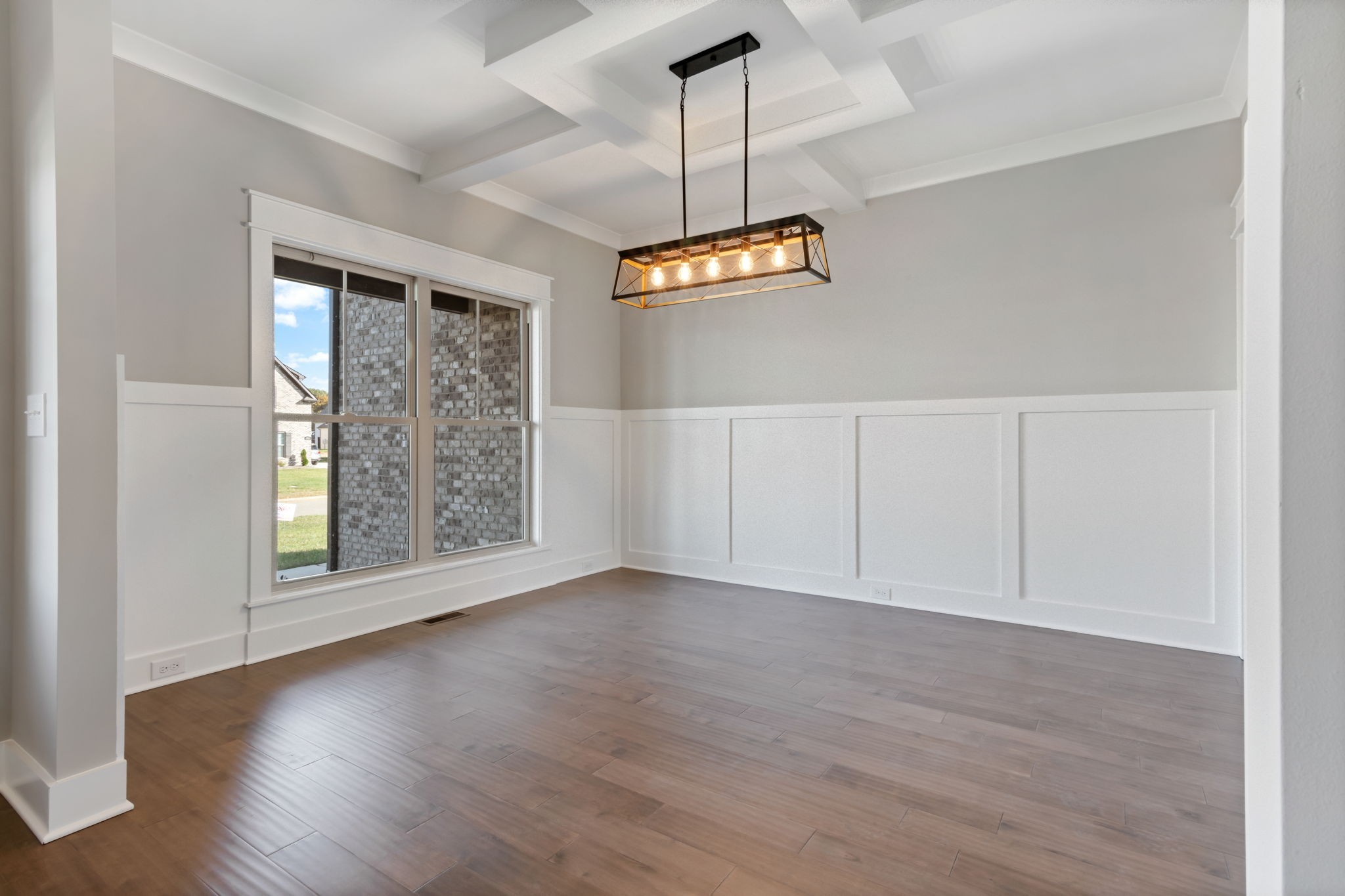 2712 Carousel Drive Murfreesboro, TN 37128 - Photo 13 of 36 an empty room with wooden floor cabinet and windows