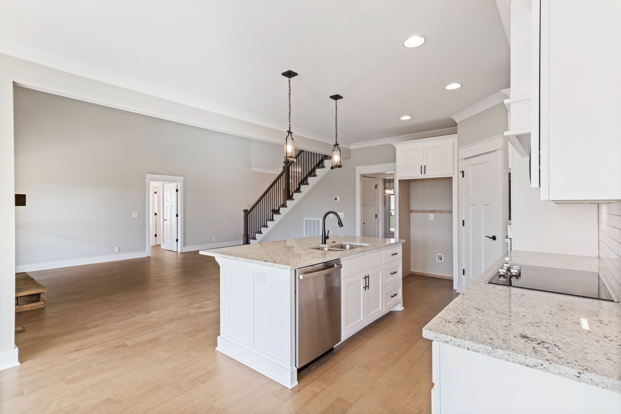 2712 Carousel Drive Murfreesboro, TN 37128 - Photo 16 of 36 a kitchen with a stove a sink a refrigerator and white cabinets