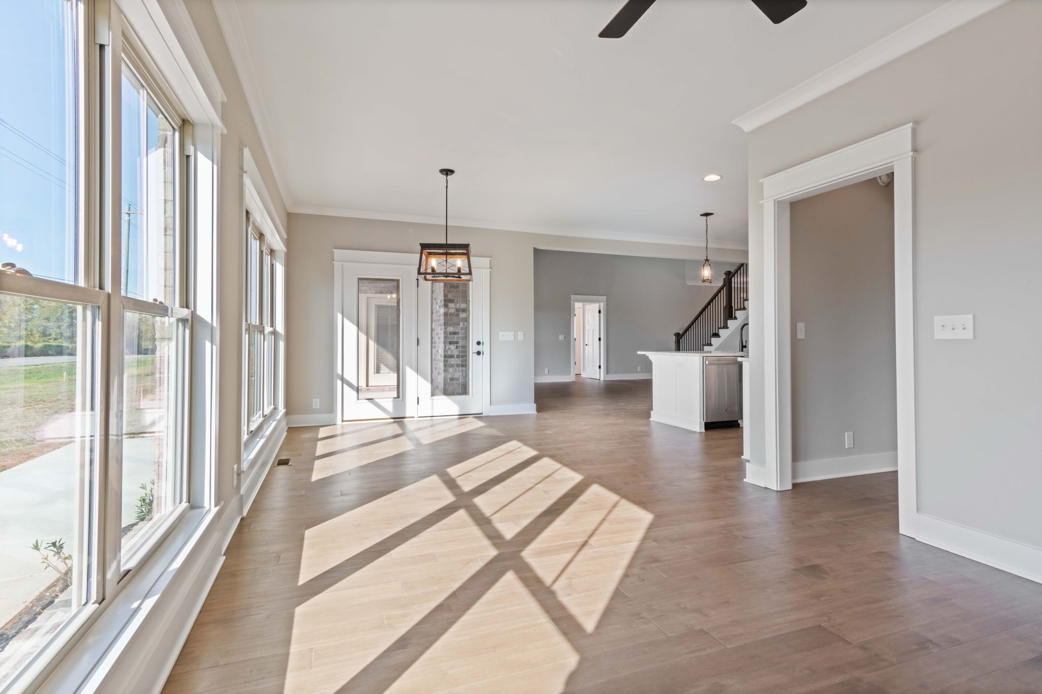 2712 Carousel Drive Murfreesboro, TN 37128 - Photo 19 of 36 a view of a hallway to a livingroom with wooden floor and windows