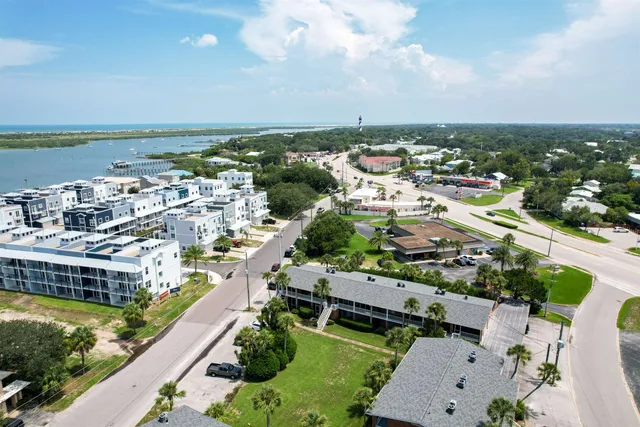 an aerial view of a city with lawn chairs