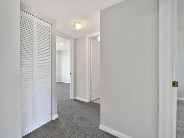 a view of a room that has a window in it