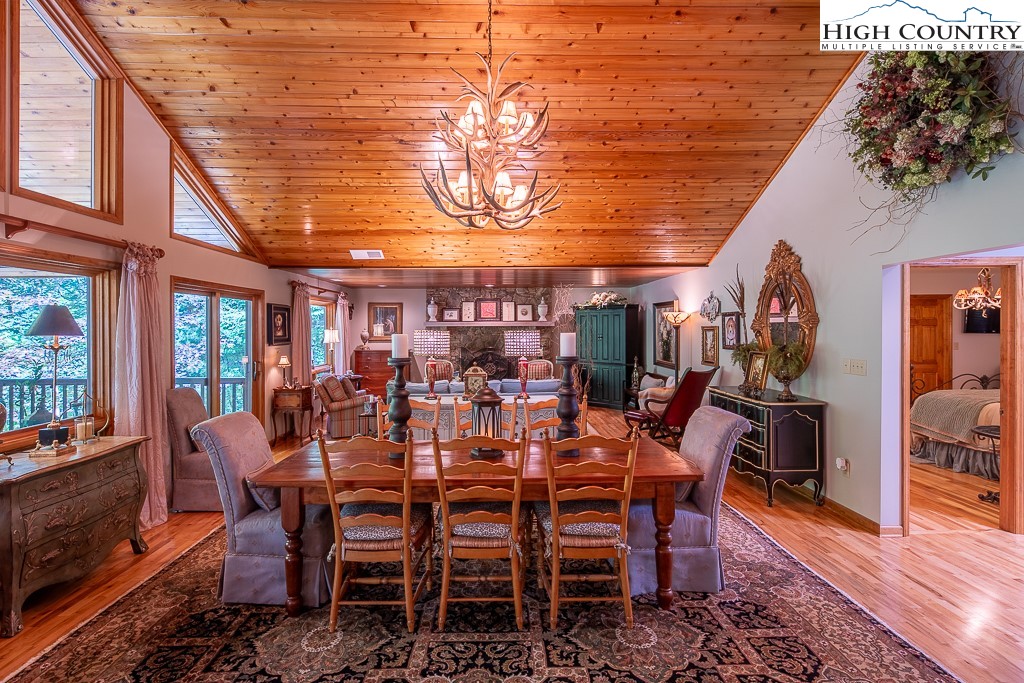 127 Apple Tree Boone, NC 28607 - Photo 13 of 50 a view of a dining room with furniture window and wooden floor