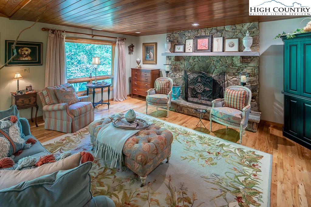 127 Apple Tree Boone, NC 28607 - Photo 15 of 50 a living room with furniture fireplace and a large window