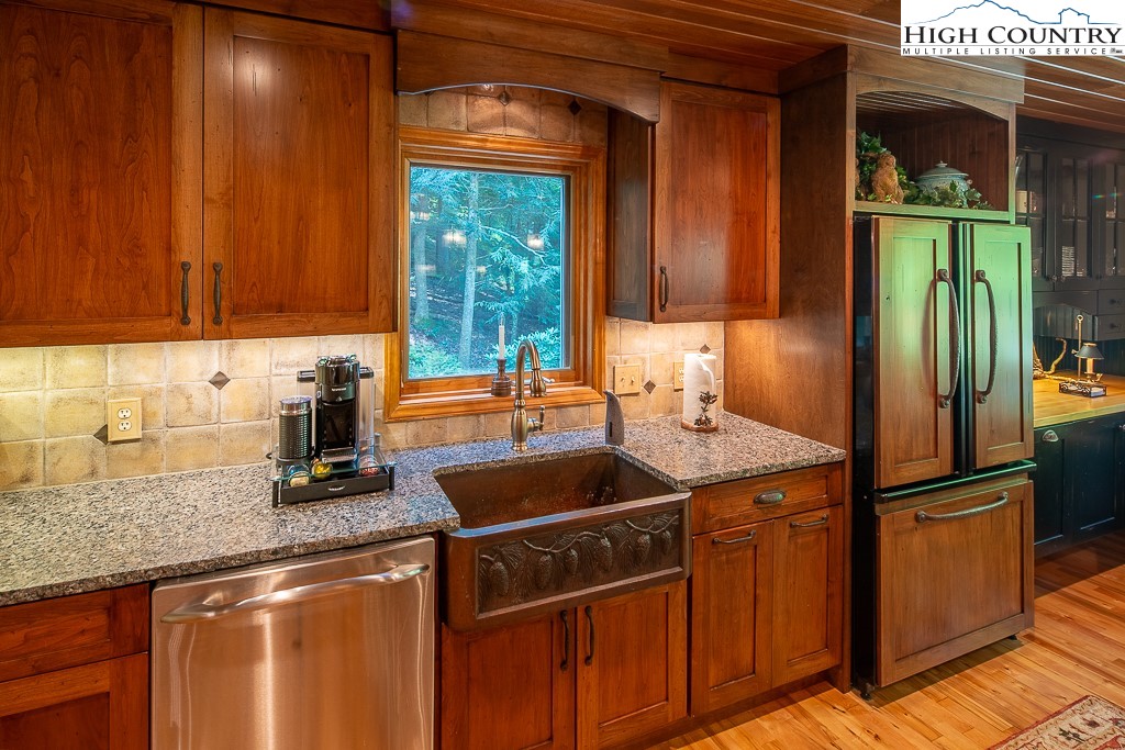 127 Apple Tree Boone, NC 28607 - Photo 18 of 50 a kitchen with stainless steel appliances granite countertop a sink stove and refrigerator