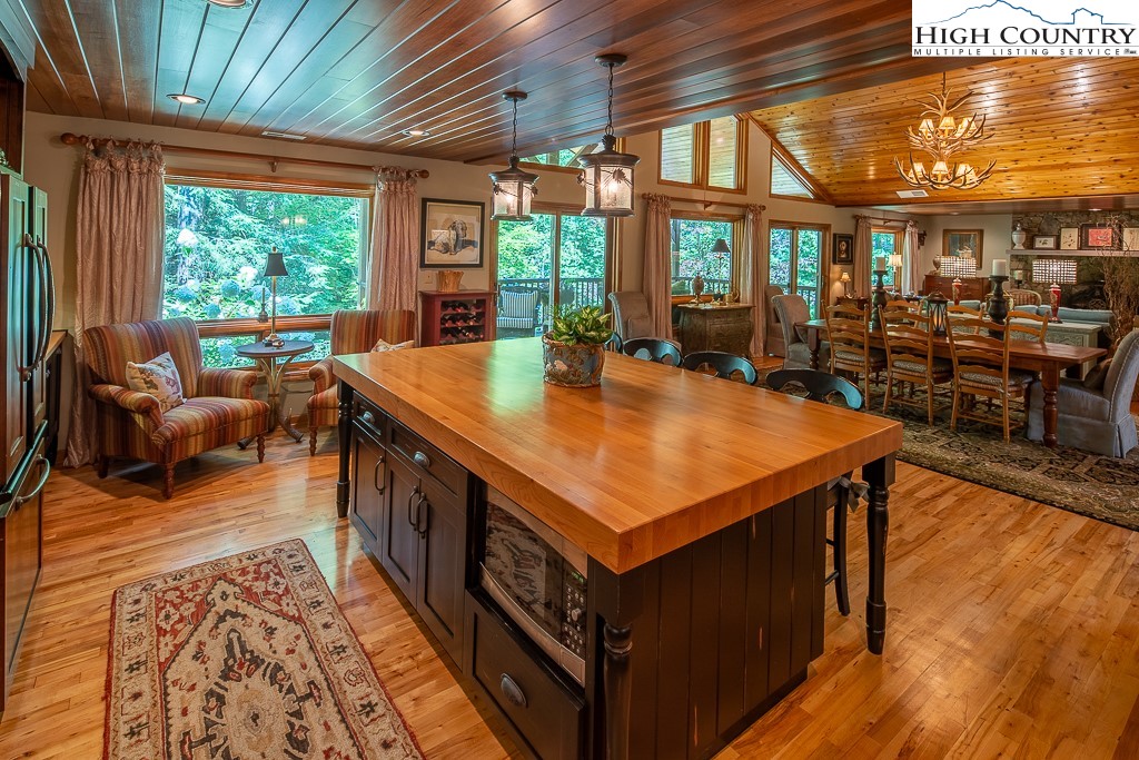 127 Apple Tree Boone, NC 28607 - Photo 19 of 50 a room with furniture and large windows