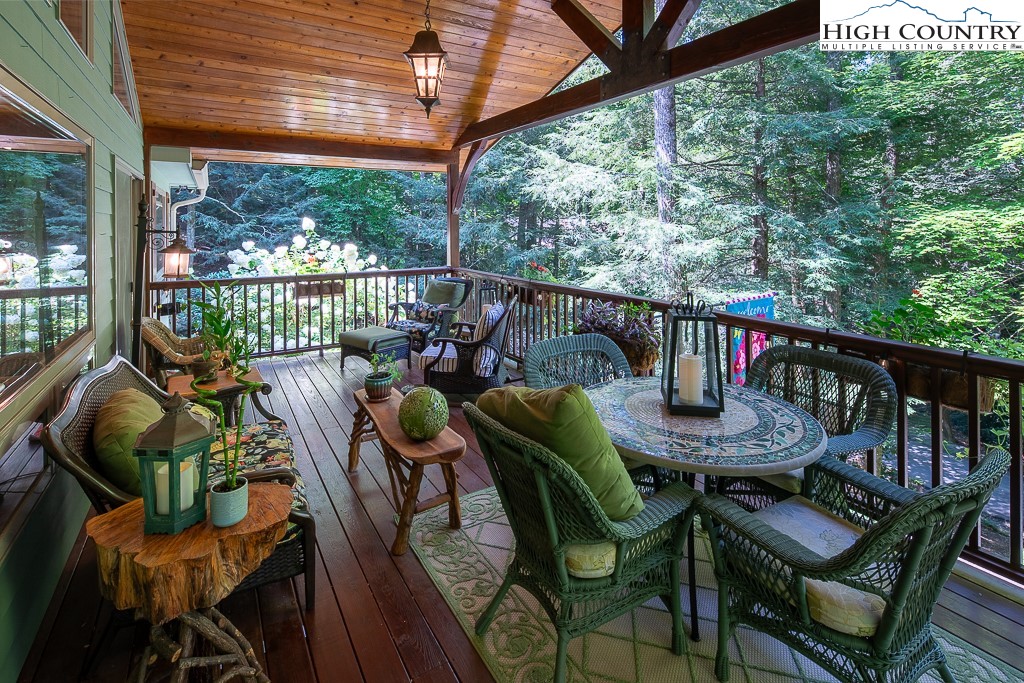 127 Apple Tree Boone, NC 28607 - Photo 22 of 50 a balcony with furniture and wooden floor