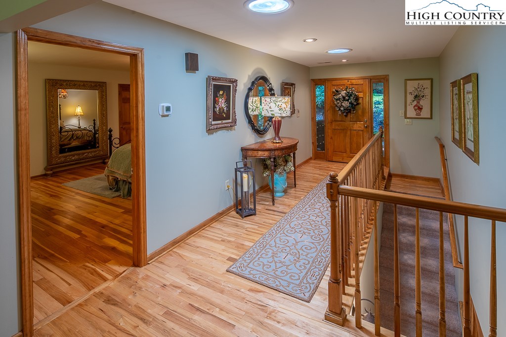 127 Apple Tree Boone, NC 28607 - Photo 26 of 50 a view of a hallway with wooden floor and furniture