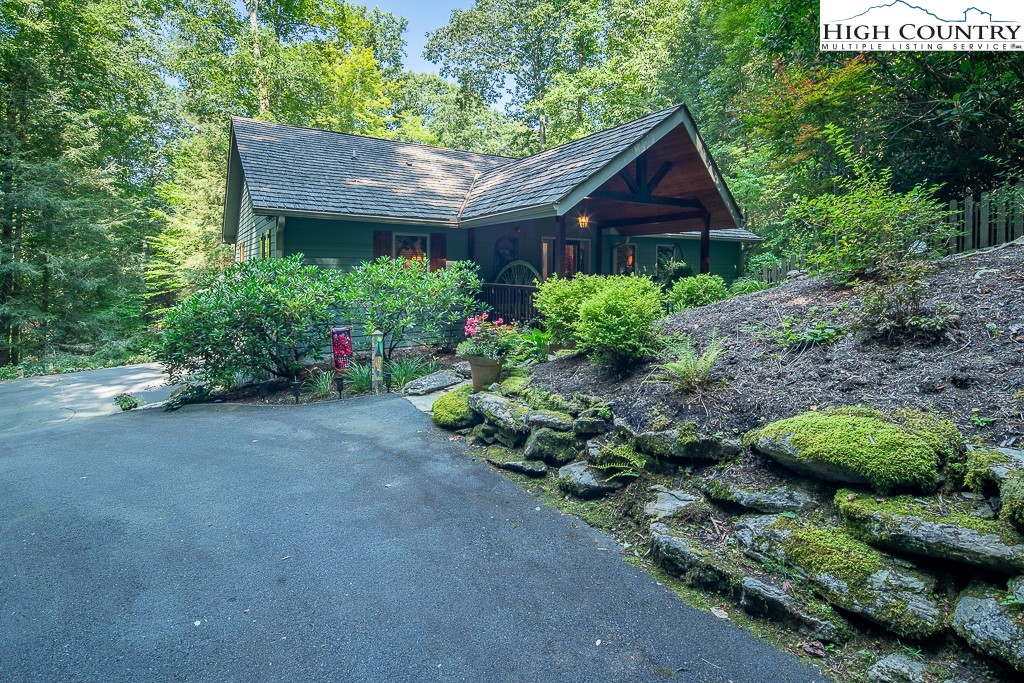 127 Apple Tree Boone, NC 28607 - Photo 3 of 50 a front view of house with a garden